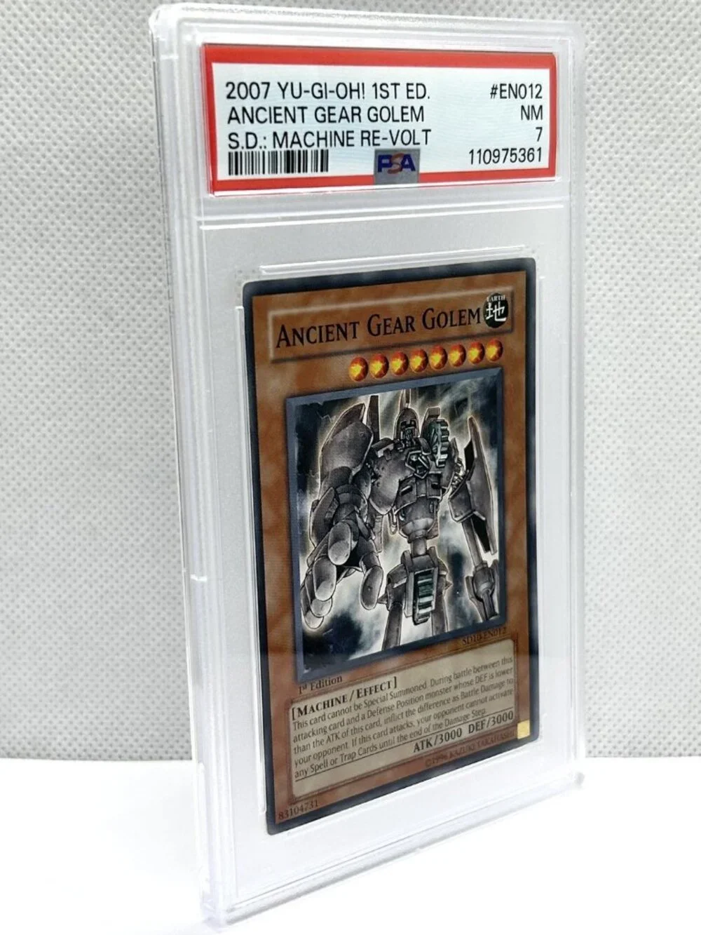 Ancient Gear Golem YU_GI-Oh! 1st Ed. 2007 S.D.; Machine Re-Volt PSA Graded 7 NM